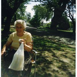 Georgina Shipley, sitting in a picnic chair, 1998