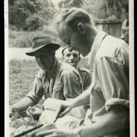 Alan Norton, Don Crabb and Eric Mangin seated outside