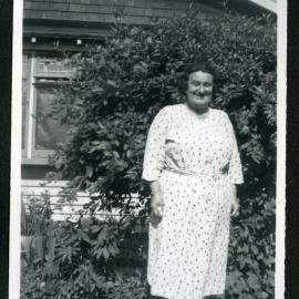 Unidentified woman wearing a light coloured frock 