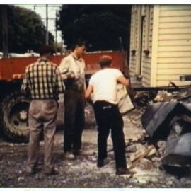 Three unidentified men with truckload of scrap