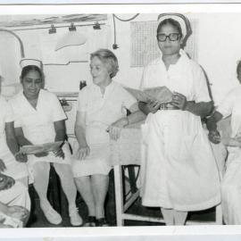 Beryl Howie is seated with unidentified nurses, Ludhiana