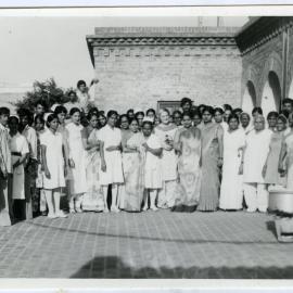 Large group photograph of Beryl Howie (centre) with staff and patients of the Christian Medical College and Hospital, Ludhiana