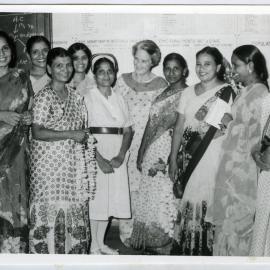 Beryl Howie stands among a group of unidentified women, one woman is wearing a nurses uniform, Christian Medical College and Hospital, Ludhiana