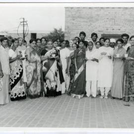 An unidentified group of Indian women, some holding tea cups and saucers, Christian Medical College and Hospital, Ludhiana