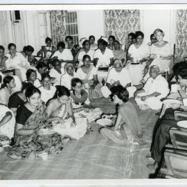 Beryl Howie and group of unidentified women and men sit in a circle enjoying a refreshment, Christian Medical Hospital, Ludhiana