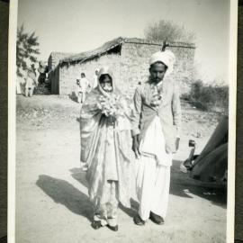 "Wedding Groups,"  an unidentified woman and man walking during a wedding