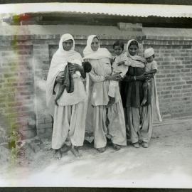"Munsi, Shankari, Anti," three Indian women holding their Children