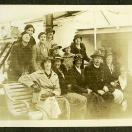 Lorraine E. Saunders, and unidentified minister and woman stand on board a vessel to India