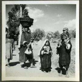 "Kashmir Types," a small group of unidentified young women and children walking