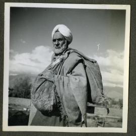 "Kashmir Types," an older man carrying sacks