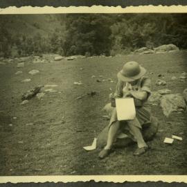 "Home mail," Lorraine E. Saunders writing a letter