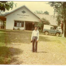Johanes Rante Banu in Front of the Main Hall at Tangmentoe