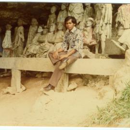 Andarias Lebang in Front of the Statues of Deceased at Kete