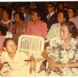 Group of People Sitting Inside a Hall