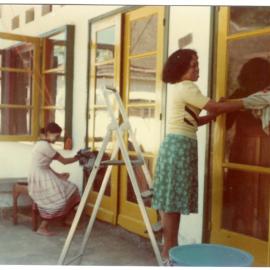 Guesthouse Servants Cleaning Windows