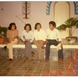 Group of Students Sitting on a Bench