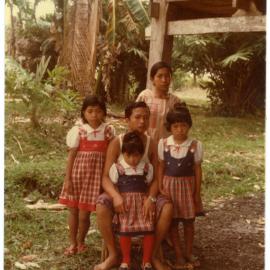Ruben Kapa with Children, Outside the Home of His Parents