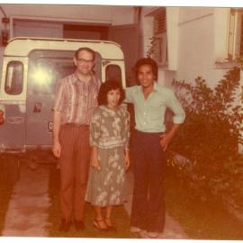 Robert Patterson with Two Tingkat Students, in Front of His House