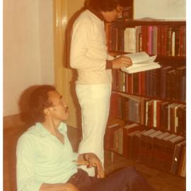 Johny Ogelang and Djalindu Bintela in Front of Robert Patterson's Bookcase