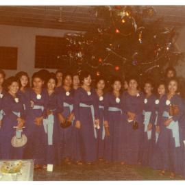 Members of the Women's Choir in Front of the Christmas Tree