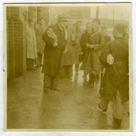 Graeme Orr waiting for a bus to a mystery run at Haywards, Presbyterian Harrier Club - Wellington, 1947