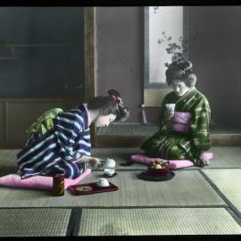 "A woman making tea for her visitor"