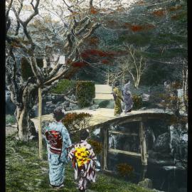 "Geisha girls upon a bridge over the pond in a tea house garden"