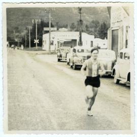 "Ian Ruffell smiling (or grimacing) as he enters Featherstone, Masterton Relay," Presbyterian Harrier Club - Wellington