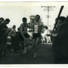 "A touch of Swan Lake! Bob Elder taking over from Ian Brown at Greytown," Masterton Relay, 1964, Presbyterian Harrier Club - Wellington