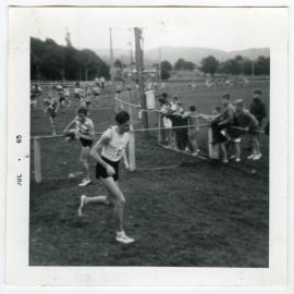 John Boswell leads Alan Thorley (Methodist) over the gates in Trentham Memorial Park." 