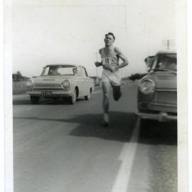 "Lap 10. Norm Gosling, flanked by Shaw and Kaywood Cars," Masterton Relay 1968, Presbyterian Harrier Club - Wellington