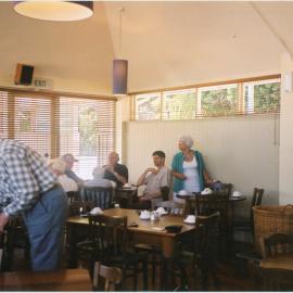 Wadestown Parishioners sitting at table in the Hall