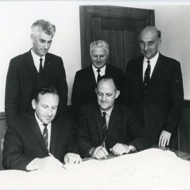 Signing the contract for Salmond Hall