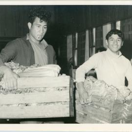 Two Māori Young Men Carrying Produce