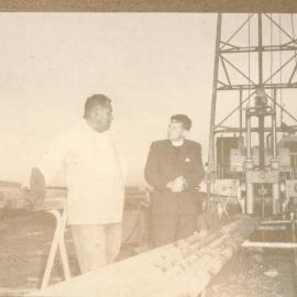 Rev. Bruce M. Patterson and Another Man Inspecting Machinery At Turangi