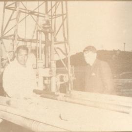 Rev. Bruce M. Patterson and Another Man Inspecting Machinery At Turangi