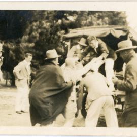 Unknown Group Climbing Into a Truck
