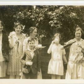 Seven Young Adults Enjoying a Garden Party