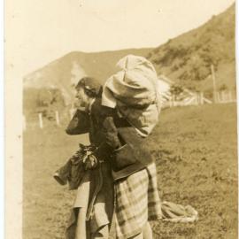 Unknown Woman With A Pack On Her Back