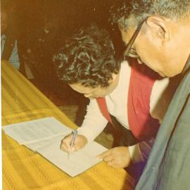 Unknown Māori Couple Signs A Register