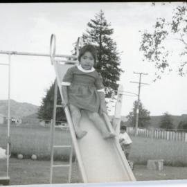 Tamariki On A Playground Slide