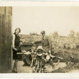 Two People and a Motorcycle In Scotland