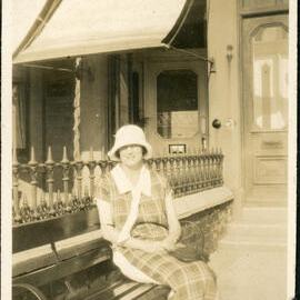 Unknown Woman Sitting On A Bench