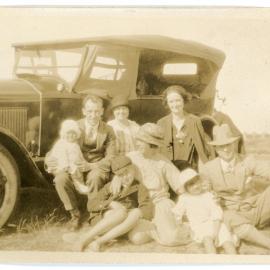 Eight Resting Next To A Car 