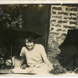 Unknown Woman Relaxing Under Umbrella