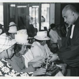 Rev L.I. Sio with Communion During A Service 