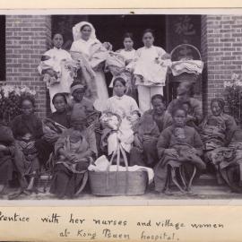 Nurses With Villagers And Babies.