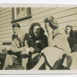 Unknown group having tea
