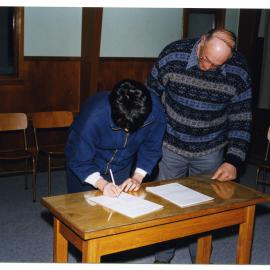 Signing lease for Sunday School Building