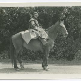 Unknown man, riding a horse
